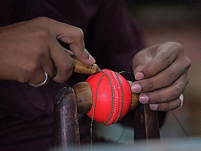 a worker stitches a pink cricket ball at a factory in sialkot photo getty a worker stitches a pink cricket ball at a factory in sialkot photo getty