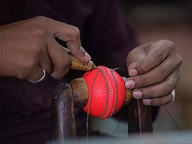 a worker stitches a pink cricket ball at a factory in sialkot photo getty a worker stitches a pink cricket ball at a factory in sialkot photo getty