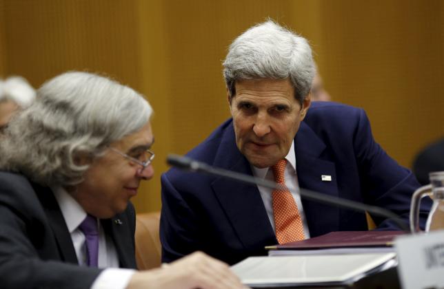 us secretary of state john kerry talks to us secretary of energy ernest moniz l during a plenary session at the united nations building in vienna austria photo reuters