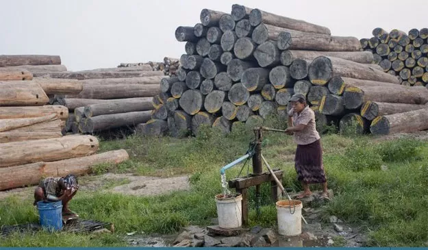 workers taking a bath from a well at a logging area on the outskirts of yangon myanmar photo afp workers taking a bath from a well at a logging area on the outskirts of yangon myanmar photo afp
