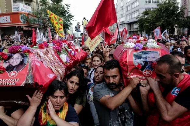 mourners carry the coffins of victim duygu tuna and ismet seker during funeral of victims who were killed in a suicide bomb attack two days before in the southern turkish town of suruc on july 22 2015 at gazi district in istanbul photo afp mourners carry the coffins of victim duygu tuna and ismet seker during funeral of victims who were killed in a suicide bomb attack two days before in the southern turkish town of suruc on july 22 2015 at gazi district in istanbul photo afp
