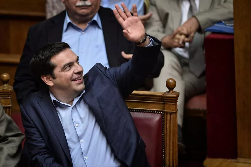 greek prime minister alexis tsipras smiles after lawmakers approved new reforms despite a major rebellion amongst mps in his leftist syriza party photo afp greek prime minister alexis tsipras smiles after lawmakers approved new reforms despite a major rebellion amongst mps in his leftist syriza party photo afp