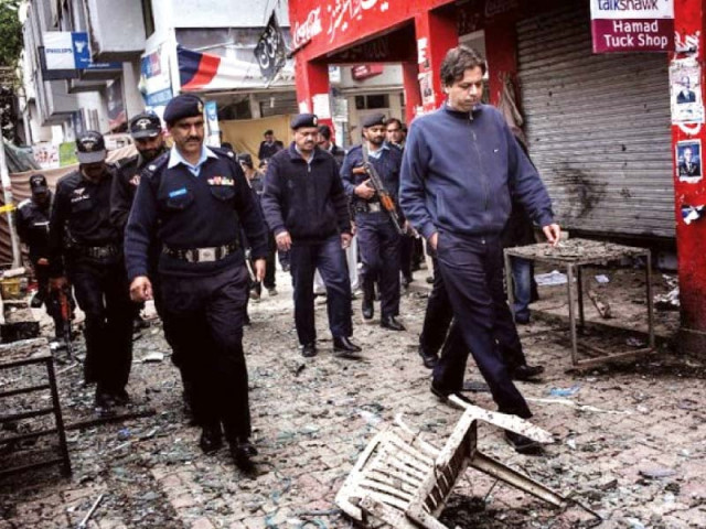 policemen inspecting the aftermath of the 2014 kutchery attack photo file policemen inspecting the aftermath of the 2014 kutchery attack photo file
