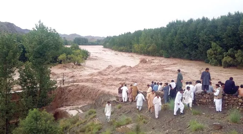 people watch salyaza stream flow in full flood in zhob district photo banaras khan express people watch salyaza stream flow in full flood in zhob district photo banaras khan express