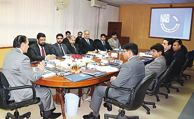 nab chairman qamar zaman chaudhry presides over a meeting at the nab k p regional bureau photo nni