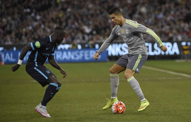 bacary sagna l of manchester city watches the footwork of cristiano ronaldo of real madrid during the international champions cup football match between english premier league team manchester city and spanish side real madrid in melbourne on july 24 2015 photo afp bacary sagna l of manchester city watches the footwork of cristiano ronaldo of real madrid during the international champions cup football match between english premier league team manchester city and spanish side real madrid in melbourne on july 24 2015 photo afp