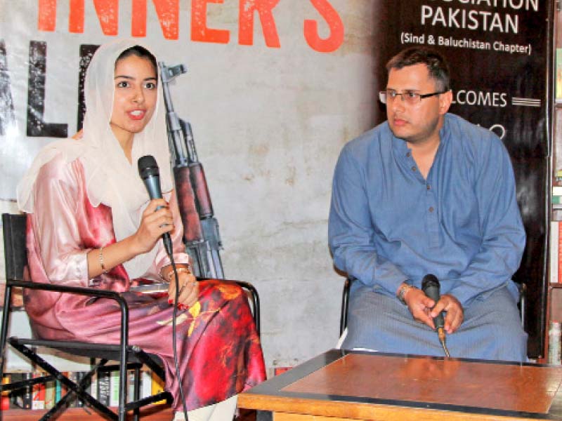 omar shahid hamid sits with a moderator at t2f at the launch of his second book the spinner s tale the book revolves around the life of omar saeed sheikh known for his role in kidnapping and murder of wall street journal reporter daniel pearl photo aysha saleem express