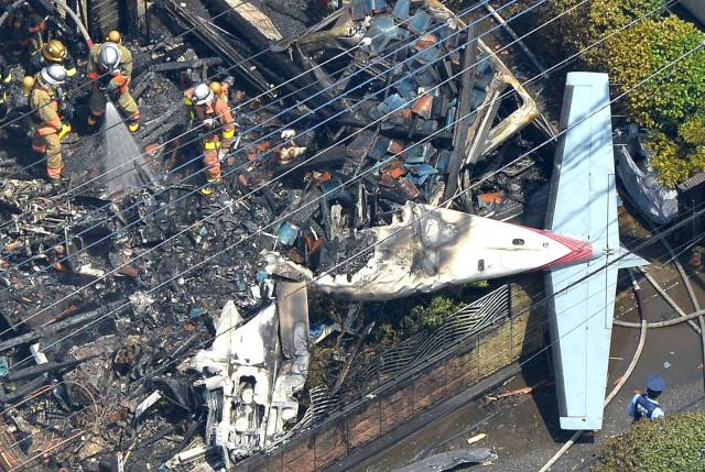 an aerial view shows debris of a crashed light plane and burning house are seen after the plane went down in a residential area and burst into flames in chofu outskirt of tokyo in this photo taken by kyodo july 26 2015 photo reuters an aerial view shows debris of a crashed light plane and burning house are seen after the plane went down in a residential area and burst into flames in chofu outskirt of tokyo in this photo taken by kyodo july 26 2015 photo reuters