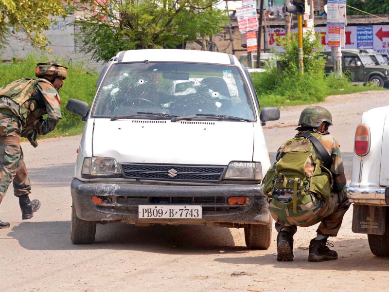 indian soldiers take cover during the encounter with the attackers photo afp