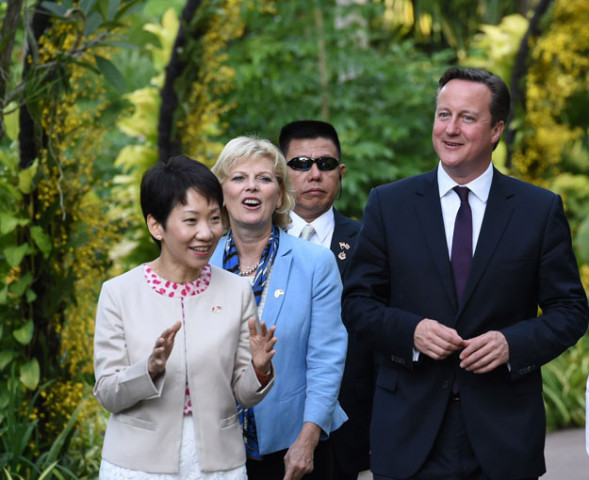british prime minister david cameron r with his minister of state for small business anna soubry 2nd l and singaporean minister in the prime minister 039 s office grace fu l tour the recently declared unesco world heritage site singapore botanic gardens on july 28 2015 photo afp british prime minister david cameron r with his minister of state for small business anna soubry 2nd l and singaporean minister in the prime minister 039 s office grace fu l tour the recently declared unesco world heritage site singapore botanic gardens on july 28 2015 photo afp