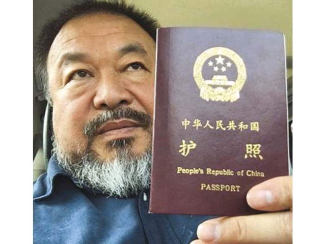 ai weiwei poses with his passport in beijing in this handout picture photo reuters ai weiwei poses with his passport in beijing in this handout picture photo reuters