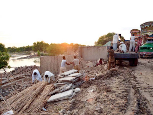 residents dismantling a house in view of flood warnings in dera ghazi khan photo online residents dismantling a house in view of flood warnings in dera ghazi khan photo online
