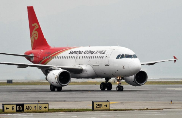a shenzhen airlines plane pictured at hong kong international airport photo afp a shenzhen airlines plane pictured at hong kong international airport photo afp