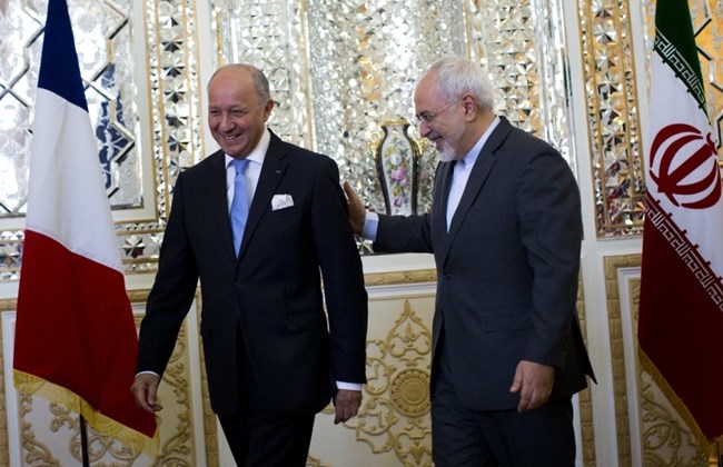 iranian foreign minister mohammad javad zarif r greets his french counterpart laurent fabius prior to their talks in tehran on july 29 2015 photo afp