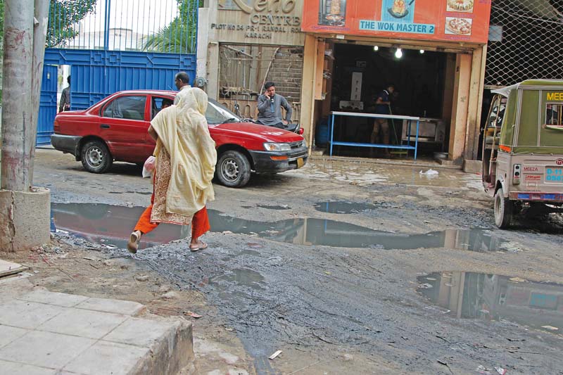 the water collected outside the our lady of fatima church is serving as a deterrent for worshippers to enter to church photo aysha saleem express