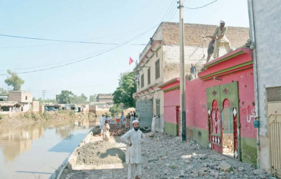 razed to ground 25 illegally built houses shops along budhni nullah demolished