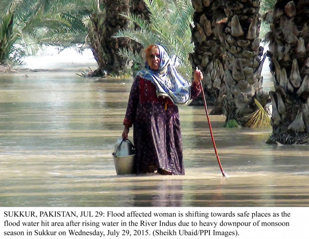 flood affected woman is shifting towards safe places as the flood water hit area after rising water in the river indus due to heavy downpour of monsoon season in sukkur on july 29 photo ppi flood affected woman is shifting towards safe places as the flood water hit area after rising water in the river indus due to heavy downpour of monsoon season in sukkur on july 29 photo ppi