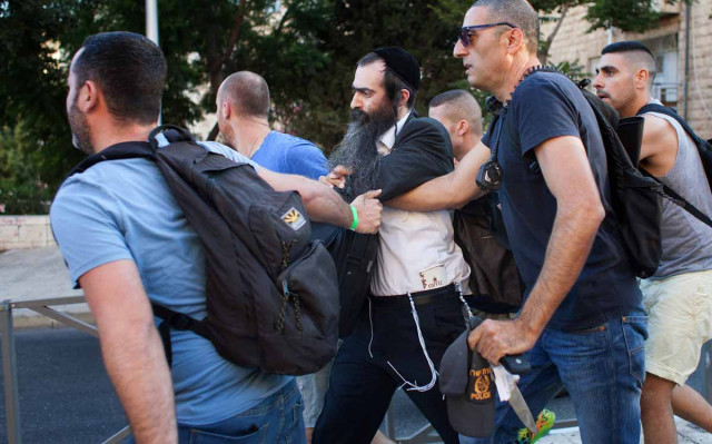 yishai shlissel c an ultra orthodox jew is arrested by israeli police after he stabbed six people taking part in a gay pride parade in central jerusalem on july 30 2015 seriously wounding two photo afp yishai shlissel c an ultra orthodox jew is arrested by israeli police after he stabbed six people taking part in a gay pride parade in central jerusalem on july 30 2015 seriously wounding two photo afp