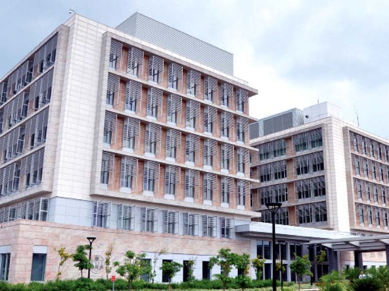 the new building includes an array of solar panels energy efficient lighting and architectural sunshades to reduce heat in the building photo inp