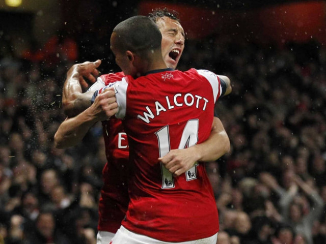 santi cazorla and theo walcott have signed a contract extension with arsenal photo afp santi cazorla and theo walcott have signed a contract extension with arsenal photo afp