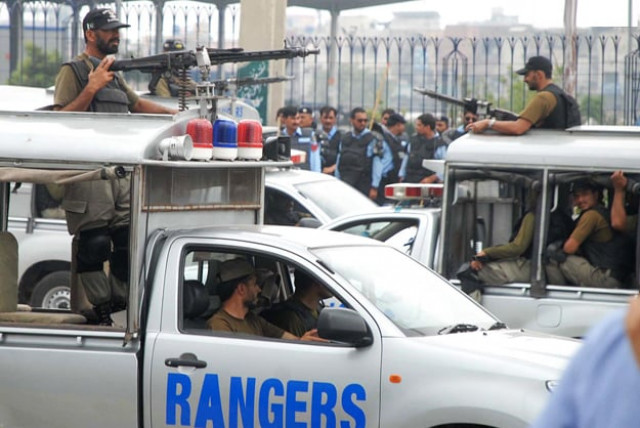 rangers soldiers standing alert during an anti encroachment operation at i 11 afghan katchi basti photo online rangers soldiers standing alert during an anti encroachment operation at i 11 afghan katchi basti photo online