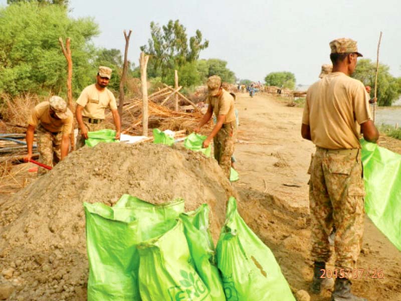 army personnel work on strengthening bunds in sukkur the shank bund was saved from being breached by the army jawans photo express