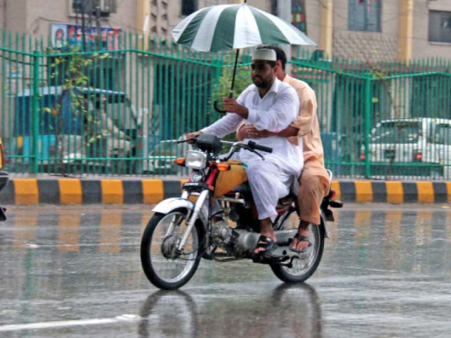 men ride a motorcycle during rain in city photo muhammad iqbal express men ride a motorcycle during rain in city photo muhammad iqbal express