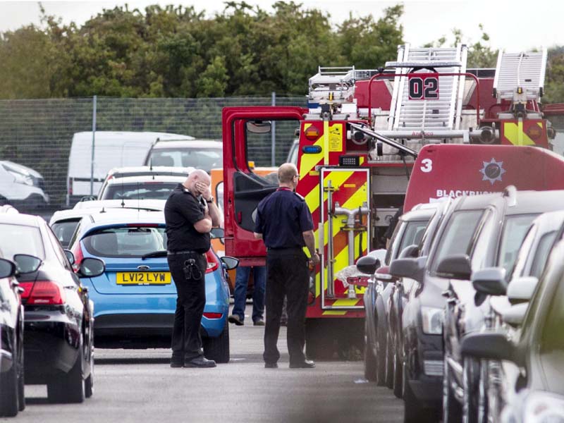 members of the emergency services attend the scene of the crash photo afp