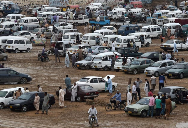 in this photograph taken on july 26 2015 people gather around cars at the sunday car market in karachi photo afp in this photograph taken on july 26 2015 people gather around cars at the sunday car market in karachi photo afp