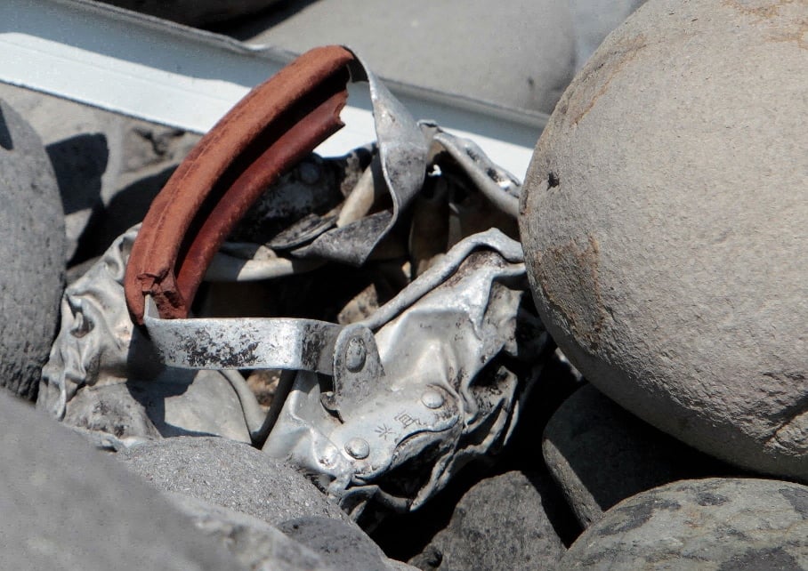 this picture taken on august 2 2015 shows metallic debris found on a beach in saint denis on the french reunion island in the indian ocean close to where where a boeing 777 wing part believed to belong to missing flight mh370 washed up last week photo afp