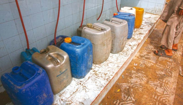 empty containers are lined up to be filled with water as lyari faces the worst kind of water crisis it ever witnessed residents are left with no option but to visit communal taps to collect the basic commodity for sustenance photo athar khan express empty containers are lined up to be filled with water as lyari faces the worst kind of water crisis it ever witnessed residents are left with no option but to visit communal taps to collect the basic commodity for sustenance photo athar khan express