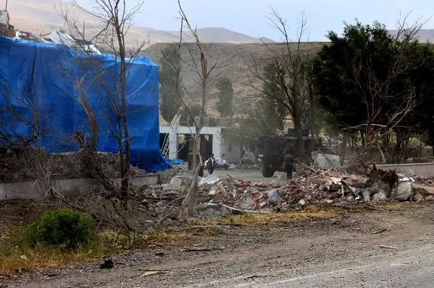 wreckage lies on the ground in front of a turkish military station covered by a tarp after a suicide atack on august 2 2015 photo afp wreckage lies on the ground in front of a turkish military station covered by a tarp after a suicide atack on august 2 2015 photo afp