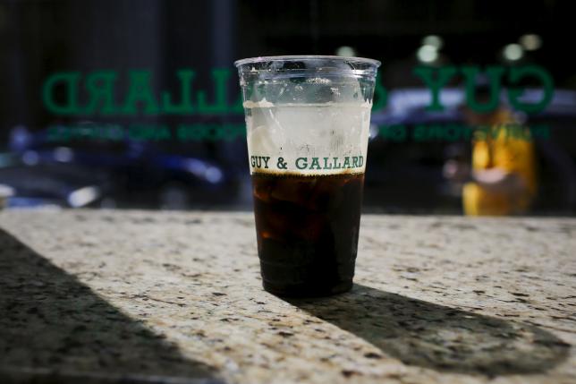 a coffee cup of a nitrogen infused cold brew coffee from brooklyn based roaster gillies coffee out of a tap is seen at guy amp gallard cafeteria in new york july 31 2015 photo reuters