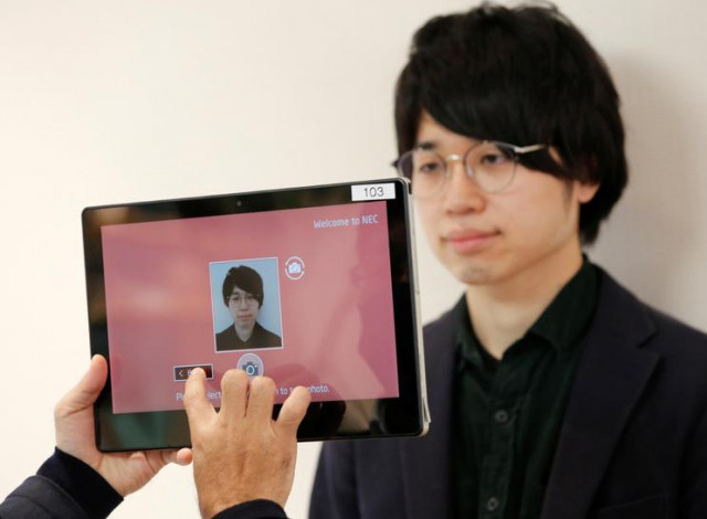 nec s staff takes a photo of shinya takashima for registration as they demonstrate a facial recognition system that identifies people even when they are wearing masks amid the coronavirus disease covid 19 outbreak at its headquarters in tokyo japan january 6 2021 picture taken on january 6 2021 photo reuters nec s staff takes a photo of shinya takashima for registration as they demonstrate a facial recognition system that identifies people even when they are wearing masks amid the coronavirus disease covid 19 outbreak at its headquarters in tokyo japan january 6 2021 picture taken on january 6 2021 photo reuters