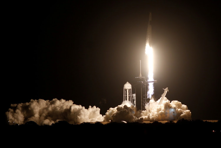 a spacex falcon 9 rocket topped with the crew dragon capsule is launched carrying four astronauts on the first operational nasa commercial crew mission at kennedy space center in cape canaveral florida us november 15 2020 photo reuters