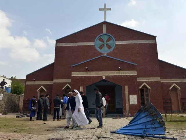 christians gather in front of a church following suicide bombing attacks on churches in lahore on march 15 2015 photo afp christians gather in front of a church following suicide bombing attacks on churches in lahore on march 15 2015 photo afp