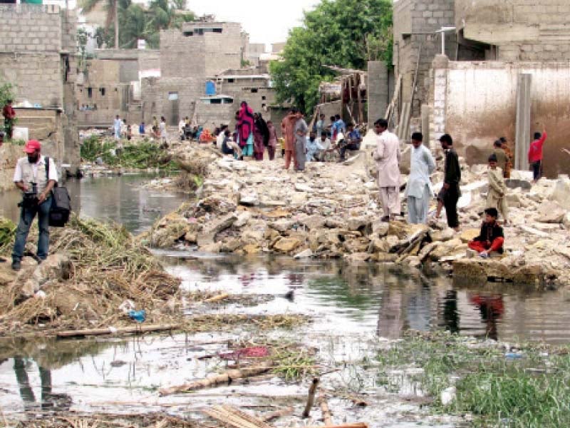 storm water drains were cleared of encroachments near cafe pyala in gulberg on monday authorities have demolished 30 constructions on storm water drains during the latest anti encroachment drive in the city photo ppi