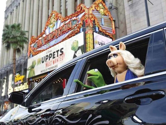 the characters of kermit and miss piggy arrive at the premiere of muppets most wanted in california in 2014 photo file the characters of kermit and miss piggy arrive at the premiere of muppets most wanted in california in 2014 photo file
