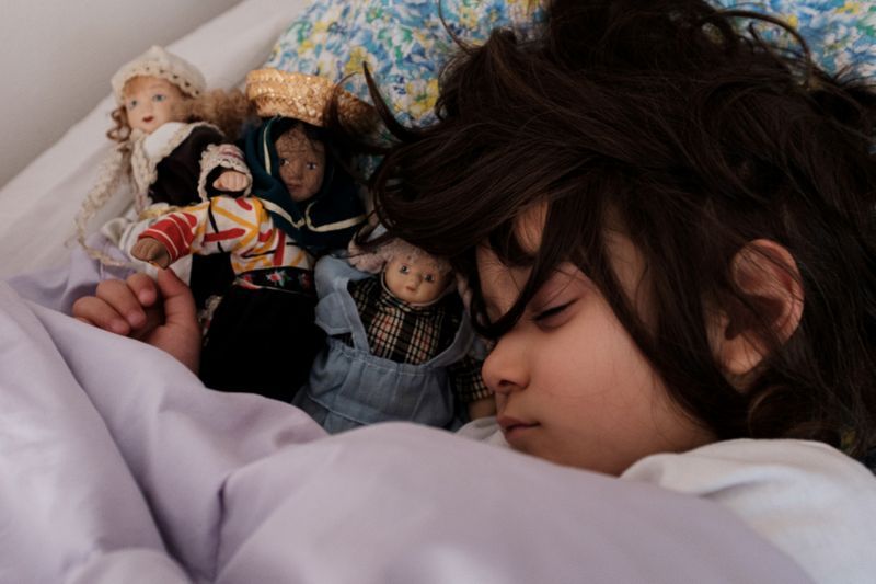 two year old bianca toniolo sleeps surrounded by her toy dolls at home in san fiorano in this picture taken by her father schoolteacher marzio toniolo april 8 2020 photo reuters