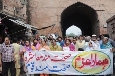 defeating dengue fever walled city residents join wcla in awareness walk defeating dengue fever walled city residents join wcla in awareness walk