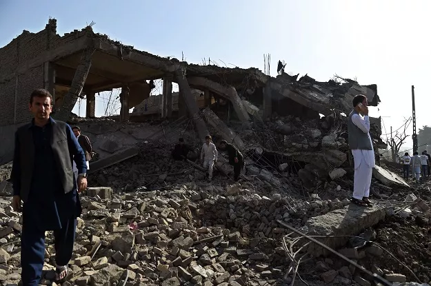 afghan residents inspect a damaged building following a powerful truck bomb explosion in kabul on august 7 2015 photo afp afghan residents inspect a damaged building following a powerful truck bomb explosion in kabul on august 7 2015 photo afp
