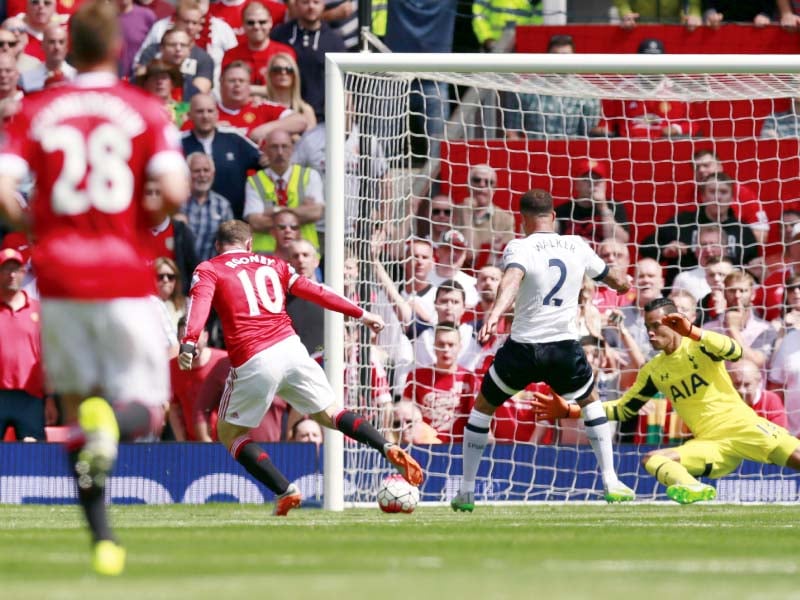 tottenham right back kyle walker inadvertently sent the ball into his own net as he tackled wayne rooney for the only goal of the season s first game photo afp