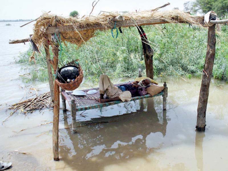 some residents of flood stricken areas have taken it upon themselves to evacuate their families to higher ground others like this man have chosen to stay back in hopes that the flood will pass within the next few days photo app