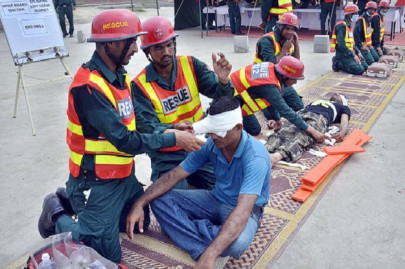 emergency services rescuers trained in dealing with emergencies at collapsed building sites graduate