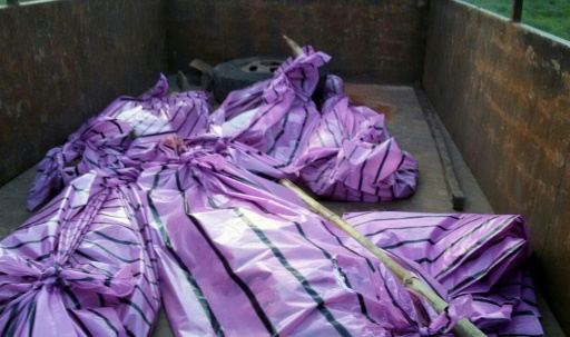 the bodies of five women killed by villagers who accused them of practicing witchcraft lay in plastic bags in kanjia village in eastern jharkhand state on august 8 2015 photo afp