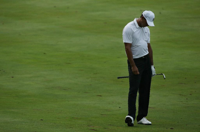 tiger woods reacts to his second shot on the 15th hole during the first round of the quicken loans national at the robert trent jones golf club photo afp tiger woods reacts to his second shot on the 15th hole during the first round of the quicken loans national at the robert trent jones golf club photo afp