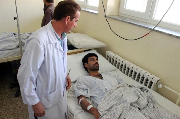 a wounded afghan receives treatment at a hospital in kunduz province on august 9 2015 photo afp