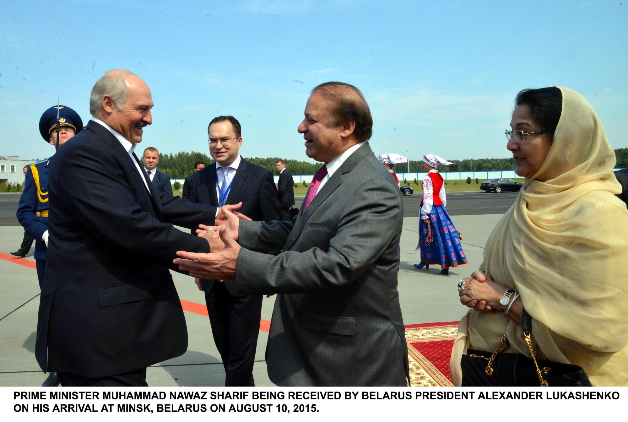 belarus president alexander lukashenko receives prime minister nawaz at minsk airport on august 10 2015 photo pid