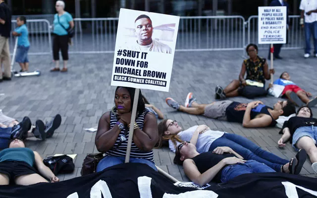 demonstrators showed support sunday on the one year anniversary of 18 year old michael brown an unarmed black teen who was shot and killed in ferguson missouri by a white police officer darren wilson throwing america 039 s troubled race relations into harsh relief photo afp demonstrators showed support sunday on the one year anniversary of 18 year old michael brown an unarmed black teen who was shot and killed in ferguson missouri by a white police officer darren wilson throwing america 039 s troubled race relations into harsh relief photo afp