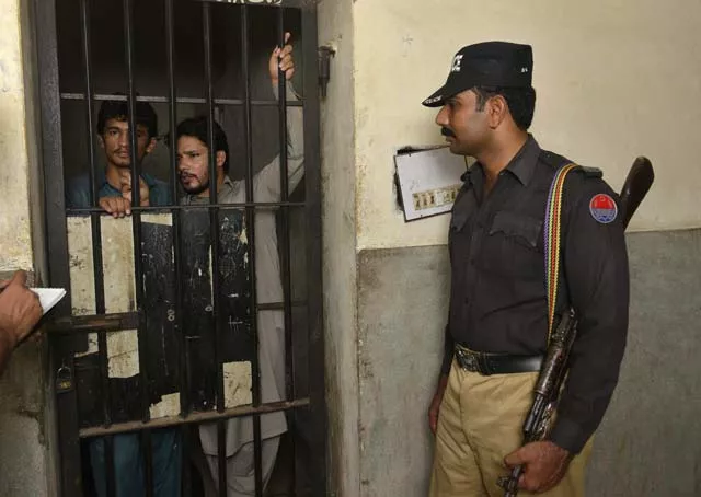arrested gang members of a sexual abuse scandal stand in the police lockup as they speak to the media in hussain khanwala village on august 9 2015 photo afp arrested gang members of a sexual abuse scandal stand in the police lockup as they speak to the media in hussain khanwala village on august 9 2015 photo afp